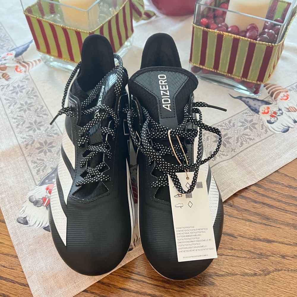 Football cleats….never worn with tag and box